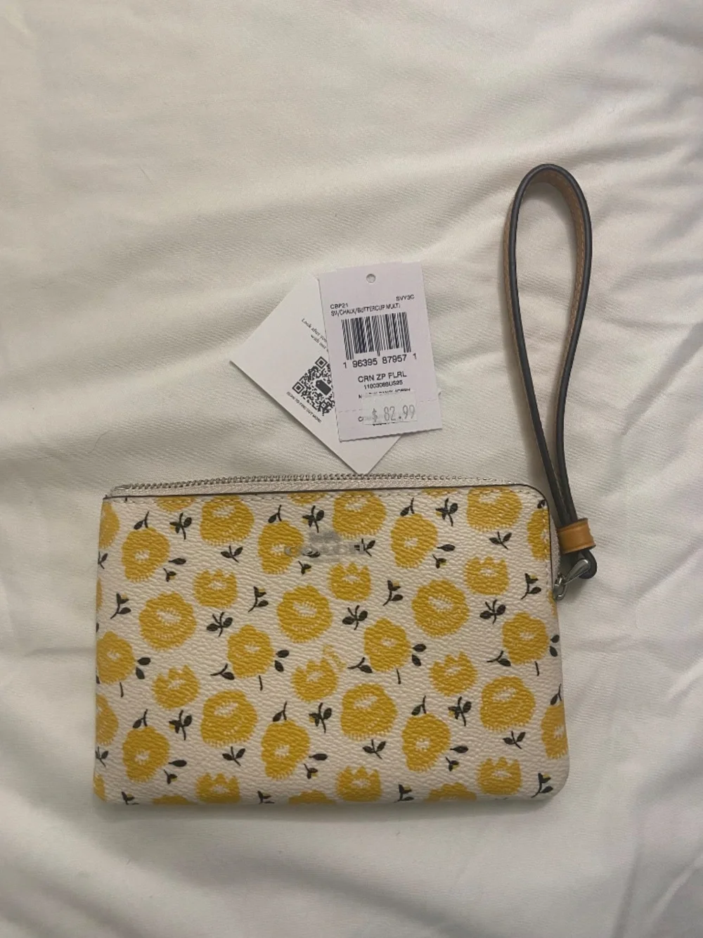 Coach wristlet with floral print